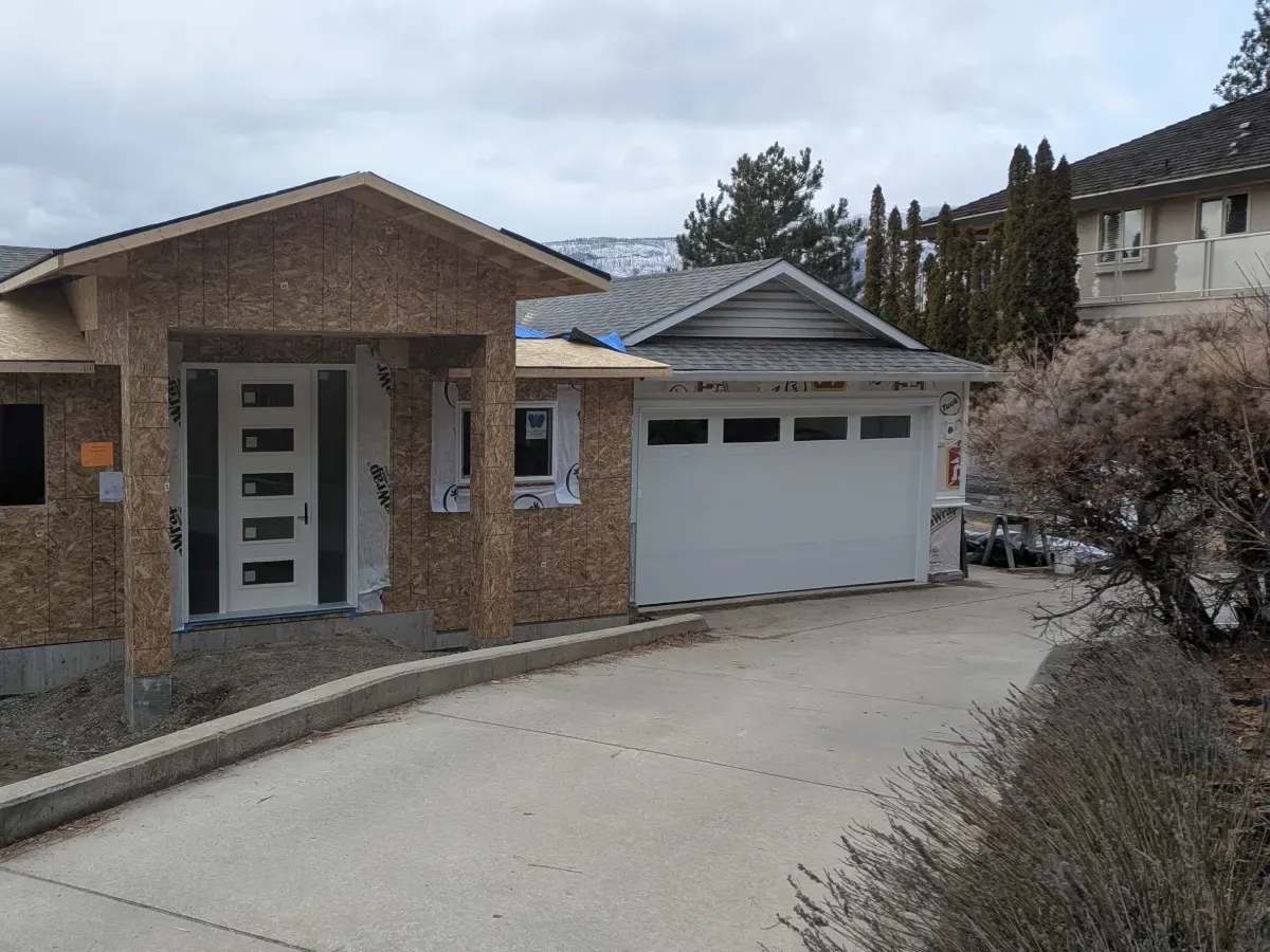 A new white garage door on a house under construction in the Okanagan